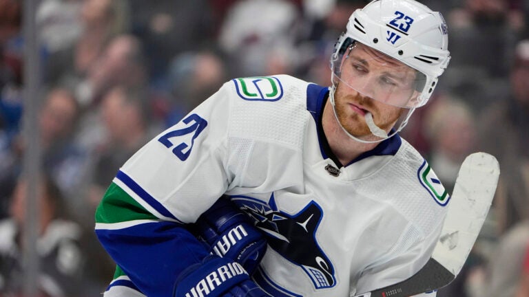 Vancouver Canucks center Elias Lindholm (23) in the third period of an NHL hockey game Tuesday, Feb. 20, 2024, in Denver.