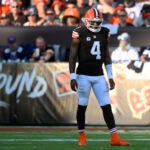Deshaun Watson stands on the field after throwing an incomplete pass in a game against the Cowboys.