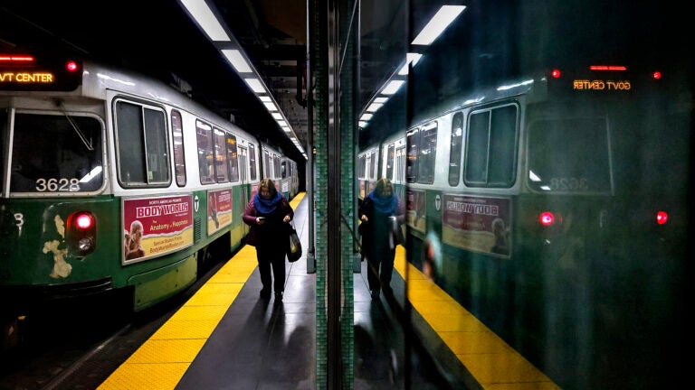 A passenger heads for the exit inside the Kenmore Station. The MBTA announced upcoming service disruptions to three lines in October.