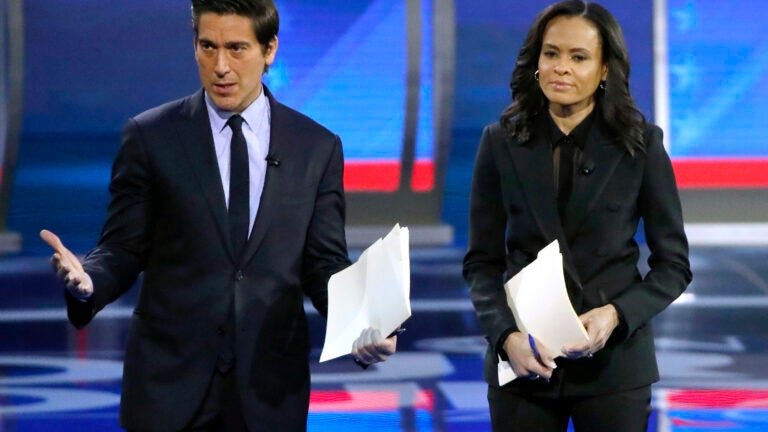 ABC World News Tonight Anchor David Muir, left, addresses members of the audience while standing with ABC News Live Anchor Linsey Davis, Friday, Feb. 7, 2020 in Manchester, N.H.