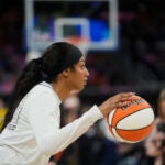 Chicago Sky's Angel Reese warms up before a game against the Fever.