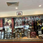 A sign hangs above the trophy case at Boston College's Conte Forum mourning the deaths of former Eagles hockey players Johnny and Matthew Gaudreau.