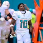 Dolphins wide receiver Tyreek Hill reacts as he runs onto the field during player introductions before a game against the Jaguars.