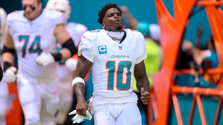 Dolphins wide receiver Tyreek Hill reacts by running onto the field during pre-game introductions against the Jaguars.