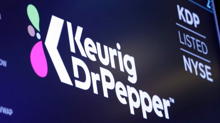 The logo for Keurig Dr. Pepper appears above a trading post on the floor of the New York Stock Exchange in 2018.