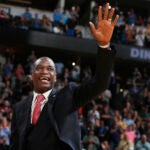 Dikembe Mutombo waves to the crowd as his jersey number was retired by the team during a Nuggets game against the Trail Blazers in 2016.