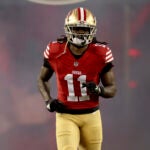 San Francisco 49ers' Brandon Aiyuk (11) enters the field before an NFL football NFC divisional playoff game against the Green Bay Packers, Saturday, Jan. 20, 2024, in Santa Clara, Calif.