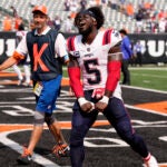 New England Patriots safety Jabrill Peppers (5) celebrates as he walks off the field after an NFL football game against the Cincinnati Bengals, Sunday, Sept. 8, 2024, in Cincinnati. The Patriots won 16-10.