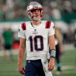 New England Patriots quarterback Drake Maye (10) warms up before playing against the New York Jets in an NFL football game, Thursday, Sept. 19, 2024, in East Rutherford, N.J.