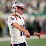 Drake Maye warms up before a game against the Jets.