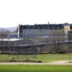FILE - The Souza-Baranowski Correctional Center is surrounded by fencing, Wednesday, April 19, 2017, in Lancaster, Mass.