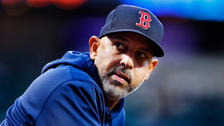 Boston Red Sox manager Alex Cora looks out of the dugout before baseball game against the New York Mets, Wednesday, Sept. 4, 2024, in New York.