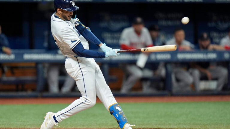 Tampa Bay Rays' Jose Siri connects for a three-run double off Boston Red Sox relief pitcher Josh Winckowski during the eighth inning.