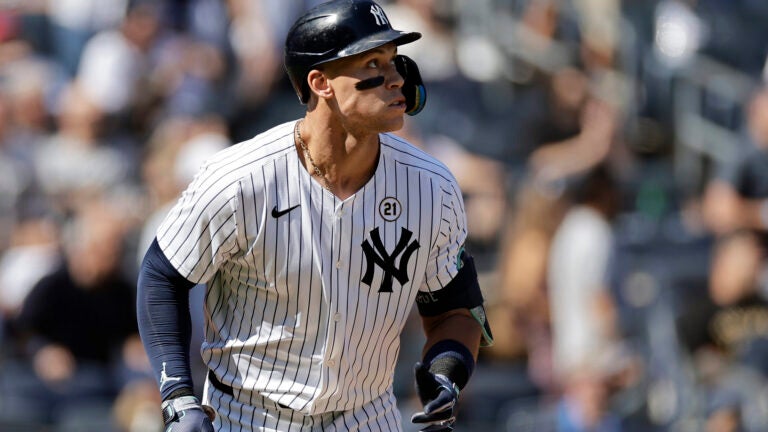 New York Yankees' Aaron Judge watches his two-run home run during the third inning of a baseball game against the Red Sox, Sunday, Sept. 15, 2024, in New York.