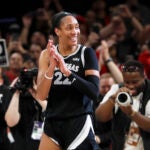 A'ja Wilson celebrates during an Aces game against the Sun.