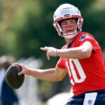 New England Patriots quarterback Drake Maye (10) throws during practice at Gillette Stadium.