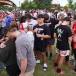 Students, faculty and community members gather for a vigil after a shooting at Apalachee High School on September 4, 2024 in Winder, Georgia.