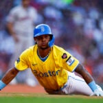 Red Sox shortstop Ceddanne Rafaela (43) shakes his head after he slides back to first and is called safe in the eighth inning during the Boston Reds vs the Houston Astros MLB game at Fenway Park on Saturday.