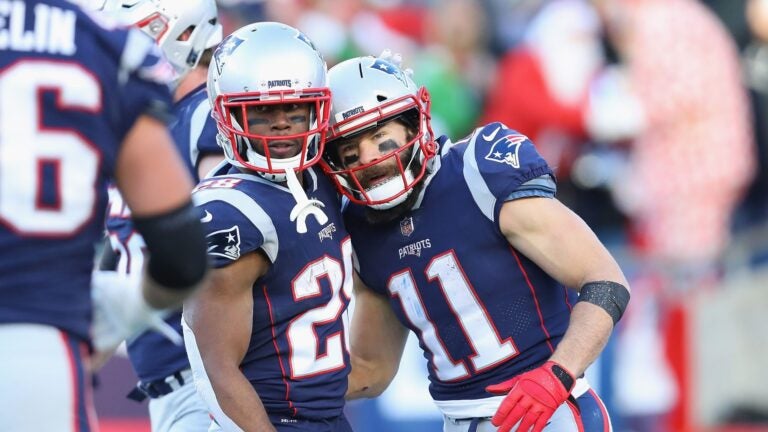 FOXBOROUGH, MA - DECEMBER 23: Julian Edelman #11 of the New England Patriots celebrates with James White #28 after scoring a 32-yard receiving touchdown during the third quarter against the Buffalo Bills at Gillette Stadium on December 23, 2018 in Foxborough, Massachusetts.