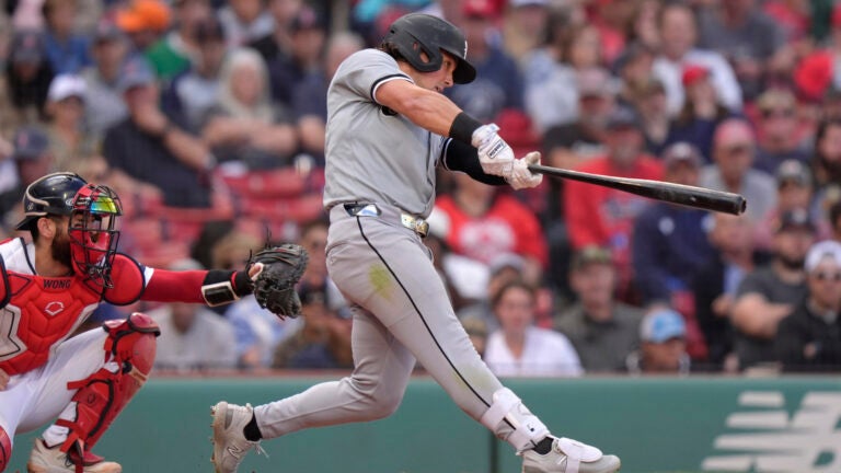 Dominic Fletcher of the White Sox hits a double in front of Red Sox catcher Connor Wong in the ninth inning.