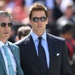 Broadcasters Kevin Burkhardt and Tom Brady walk along the field before the game between the Dallas Cowboys and Cleveland Browns at Cleveland Browns Stadium on September 08, 2024 in Cleveland, Ohio.