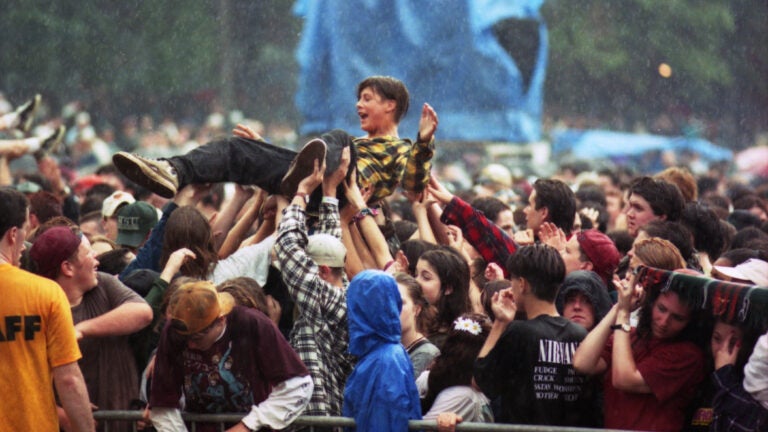 A concert-goer crowd surfs during Green Day's performance at the Hatch Shell in 1994.