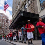 Hotel workers strike outside of the Hilton Boston Park Plaza on Sept. 2.