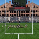 A football game between UCLA and Colorado University, at Folsom Field in Boulder, Colo., Sept. 24, 2022. A Mass. man drove onto the field and caused multiple traffic crashes on Thursday.