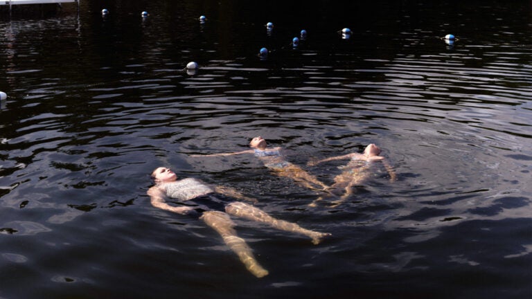 Campers cool off in the pond during Pine Creek Camp's Dirigo Experience.