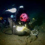 Diver Joe Mazraani unearthing part of the rigging of the Le Lyonnais shipwreck on the bottom of the Atlantic Ocean.