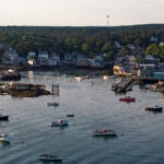 The harbor of Stonington, Maine, on Aug. 8, 2024. After two devastating storms hit Stonington in January, plans are multiplying to raise and fortify wharves, roads and buildings.