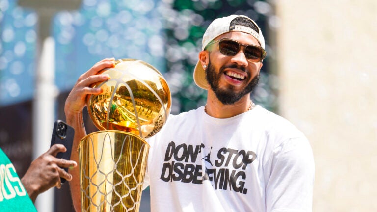 Jayson Tatum celebrates during a duck boat parade to celebrate the 18th Boston Celtics NBA championship on Friday, June 21, 2024. The Celtics defeated the Dallas Mavericks in Game 5 of the NBA Finals.