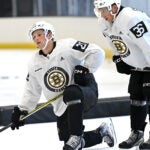 Forwards Fabian Lysell, left, and Oskar Jellvik catch their breathe during a break at Bruins development camp at Warrior Arena.