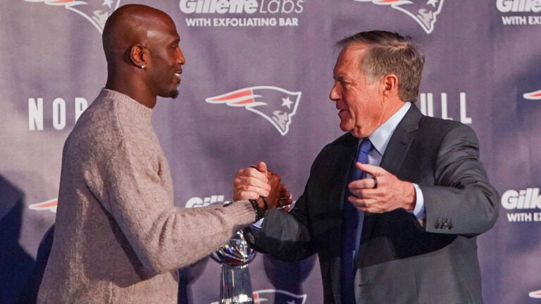 Devin McCourty and New England Patriots head coach Bill Belichick share an embrace during his retirement presser at Patriots Hall of Fame.