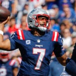 Foxborough MA 9/14/24 16patriots New England Patriots quarterback Jacoby Brissett throws a touchdown reception to Ja’Lynn Polk against the Seattle Seahawks during first quarter NFL action at Gillette Stadium. Photo by Matthew J Lee/Globe Staff