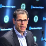 The Bruins training camp opened on Wednesday at Warrior Ice Arena. GM Don Sweeney and coach Jim Montgomery spoke to the media. Sweeney speaks at the podium.