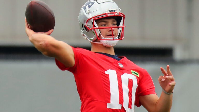 The Patriots practiced on the practice field at Gillette Stadium. Drake Maye throws a pass during a practice.