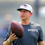 The NE Patriots held training camp at Gillette Stadium. Eliot Wolf, VP of player personnel on the sidelines.