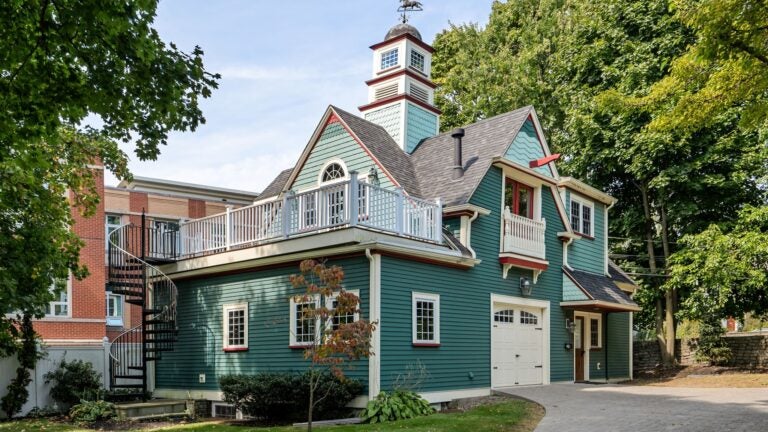 For $799k, a Dorchester carriage house with a stone fireplace. See inside.