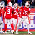 FOXBOROUGH, MASSACHUSETTS - OCTOBER 13: Drake Maye #10 of the New England Patriots celebrates with teammate DeMario Douglas #3 after a touchdown during the fourth quarter against the Houston Texans at Gillette Stadium on October 13, 2024 in Foxborough, Massachusetts.