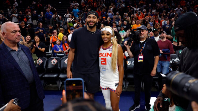 Jayson Tatum poses for a photo with DiJonai Carrington.