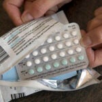 A one-month dosage of hormonal birth control pills is displayed in Sacramento, Calif., Aug. 26, 2016. People with private health insurance would be able to pick up over-the-counter methods like condoms, the “morning after” pill and birth control pills for free under a new rule the White House proposed on Monday.