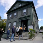 Visitors enter the Lizzie Borden House in Fall River, Mass.
