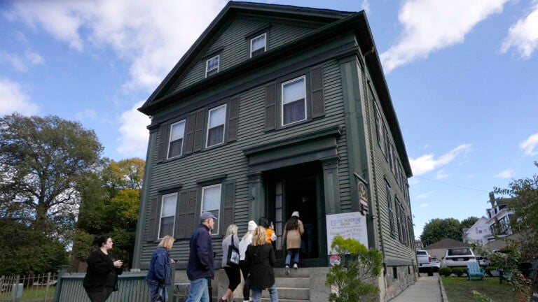 As Halloween approaches, tourists visit a Fall River home with a ...