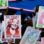 Attendees display signs for Democratic presidential nominee Vice President Kamala Harris during a campaign rally in Clarkston, Ga.