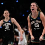 New York Liberty guard Sabrina Ionescu reacts after scoring against the Minnesota Lynx.