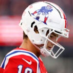 New England Patriots quarterback Drake Maye (10) walks onto the field during the fourth quarter at Gillette Stadium.