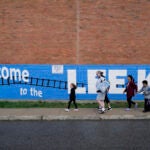 Preschool and kindergarten students arrive for the first day of school at Joseph Lee K-8 School in Dorchester on Sept. 12, 2022.
