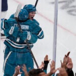 Macklin Celebrini is congratulated by William Eklund following his goal against the St. Louis Blues.