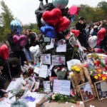 Fans gather near the Peter Pan statue in Hyde Park.